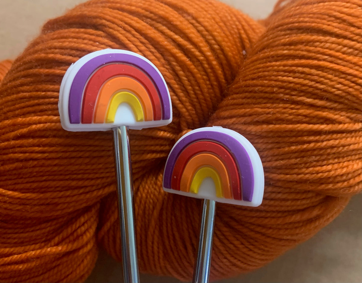 Rainbow Knitting needle toppers and point protectors.
