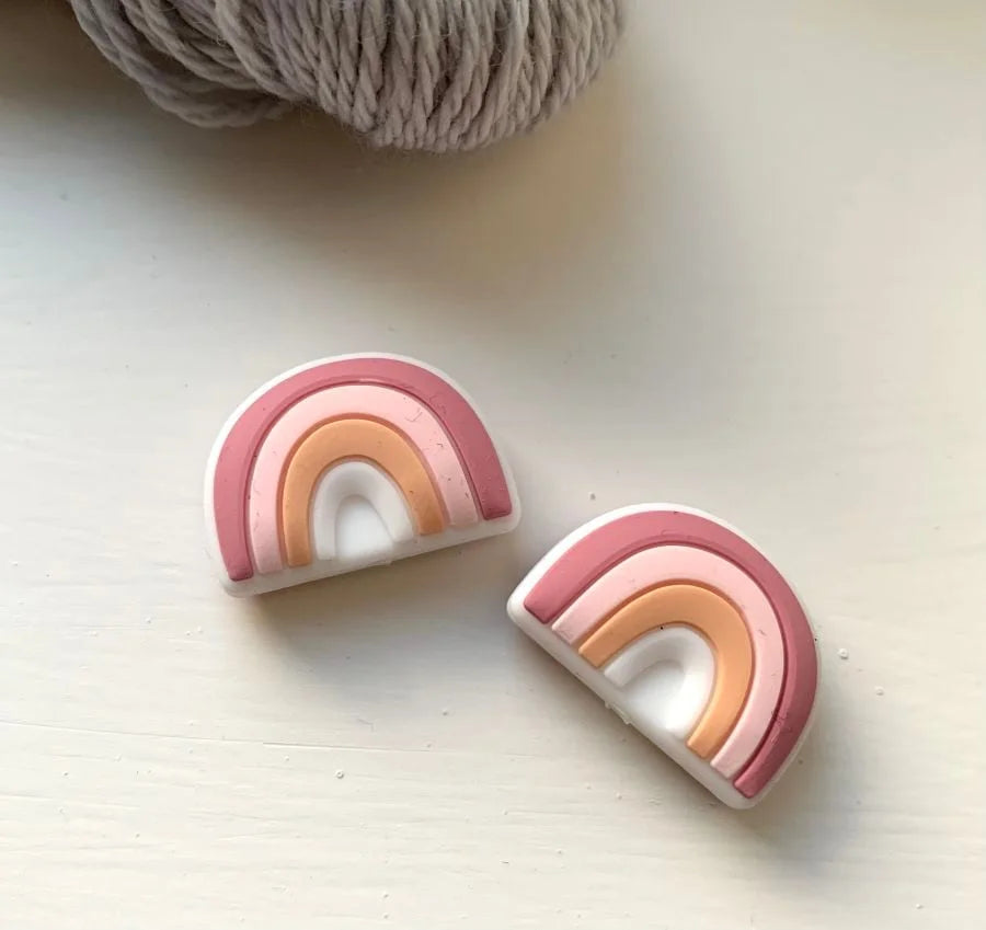 Rainbow Knitting needle toppers and point protectors.
